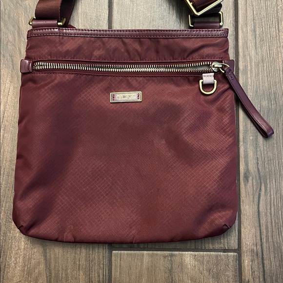 Tumi Maroon Crossbody Bag with Gold Accents - Picture 3 of 11